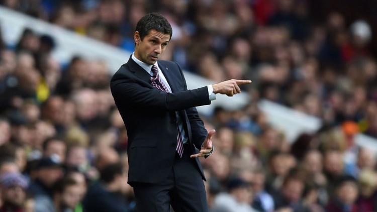 Whilst it may well make difficult reading for all the honest Villa fans out there, the 2015/16 campaign has certainly been one to forget for the Villa Park faithful so far this term. Quite frankly, this is possibly one of the worst Aston Villa sides the Premier League has EVER paid witness to… Losing both Fabian Delph and Christian Benteke across the summer transfer window hardly helped the Midlands-based club in their upcoming league duties – yet as very few of the new additions signed by Tim Sherwood have ultimately made much of a meaningful impact thus far – the excuses are beginning to run dry for the struggling top-flight outfit. So then, with everything duly taken into account for Remi Garde’s new team throughout the rest of the 2015/16 season – can the Villans somehow fight back from their current relegation-fuelled plight, or are Aston Villa already doomed to the Championship as we speak? Well, in the newly installed Remi Garde in the dug-out, Aston Villa seemingly stand alongside a manager who does in-fact carry a fair degree of potential under his belt in the modern era. Although his spell with Olympique Lyonnais was certainly brief in Ligue 1, Garde became admired for his relationship with the younger players, as well as his relatively fresh approach to dealing with his match-day duties. As there are indeed several potentially impressive youngsters currently operating at Villa Park this season – who let’s face it, haven’t really taken the Premier League by storm just yet it must be said – at least Aston Villa have something promising going for them at this stage in the proceedings. If Garde can somehow install a stronger mentality down at Villa Park this term, as well as raise some much needed positivity in and around the Aston Villa fan-base for a change, then maybe it’s only a matter of time before Lady Luck shines her light on the determined Midlanders once more… Going on current form however, the future really doesn’t look too promising for the struggling Villans out on the pitch. Their defence has been incredibly leaky to say the very least, Garde’s midfield options have failed to win most of their individual battles on a week-to-week basis, and the Aston Villa striking line-up just doesn’t scream ‘goals’ even at the best of times. Perhaps with one or two adjustments to the starting XI however, such a worrying trend can soon be seen to. The new Aston Villa manager will simply have to get the best out of Jack Grealish for one thing – for he alone possesses a level of technical ability that is rarely matched throughout the rest of his teammates – and maybe cast one eye towards the January transfer window for a little back up this season. Although such names remain somewhat unlikely to join Villa in their current predicament, the likes of QPR’s Charlie Austin, Loreint’s Lamine Kone and Anderlecht’s Samuel Bastien have all nonetheless been linked with a move to the Premier League club throughout the course of the current campaign. However, because Aston Villa distinctly failed to cover themselves in much glory across the entirety of last season, it remains difficult to imagine this club picking itself up and dusting itself off any time soon. The writing already seems to be written on the wall for Villa, as there simply isn’t enough top-flight quality among their ranks to continuously make it season after season. When all is said and done, the Villans certainly aren’t doomed at this stage by any stretch of the imagination, and will there be three worse teams than them come the end of term? Quite possibly… Yet because the Midlands-based club have seemingly been on a downward slide for quite some time now, perhaps there is no longer an opportunity for Aston Villa to prolong the inevitable. Some teams simply need to be relegated in order to grow and avoid stagnation – and although Remi Garde seems like a very capable manager at this stage in the game – the current task on his hands ultimately looks too demanding with all things considered…